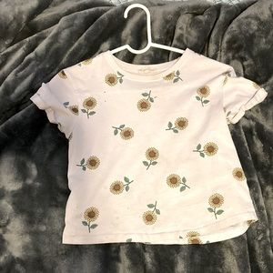 i am selling a whit t shirt that has cute sunflowers.